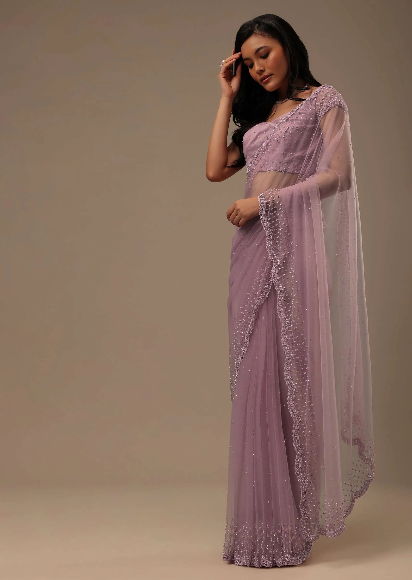 Lavender Pink Stone And Beads Embellished Net Saree